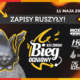 Plakat w czarno-pomarańczowej, „ognistej” stylistyce z dużym napisem „Zapisy ruszyły!” oraz logo XIII Żorskiego Biegu Ogniowego, zawierający ilustrację charakterystycznej rzeźby-diabełka z widłami, graficzne płomienie i logotypy partnerów wydarzenia.