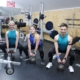 Na zdjęciu cztery instruktorki fintess ćwiczące na siłowni cardio