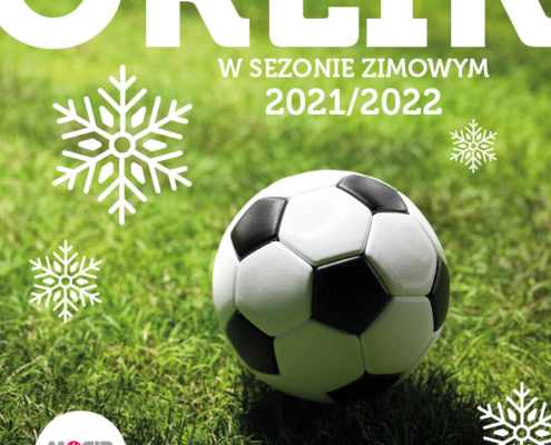 na plakacie tekst Otwarcie boisk Orlik, w tle zdjęcie murawy i piłki nożnej