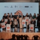 na zdjęciu wyróżnieni przedstawiciele organizatorów Biathlonu dla Każdego na scenie z nagrodami