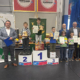 galeria zdjęć przedstawia zwycięzców zawodów szachowych na podium w żorskiej hali sportowej