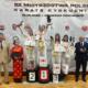 galeria zdjęć przedstawia zawody sztuk walki w hali sportowej i wręczenie nagród