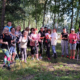 galeria zdjęć przedstawia zajęcia Nordic Walking w terenie, uczestników i ćwiczenia