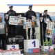 na zdjęciu zwycięzcy na podium z nagrodami