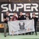 Galeria przedstawia zawodników klubu Shogun podczas gali sportów walki Super League. Na zdjęciach widoczne są walki w ringu i klatce MMA, wspólne fotografie drużyny oraz ujęcia z hali zawodów i dekoracji medalowych.